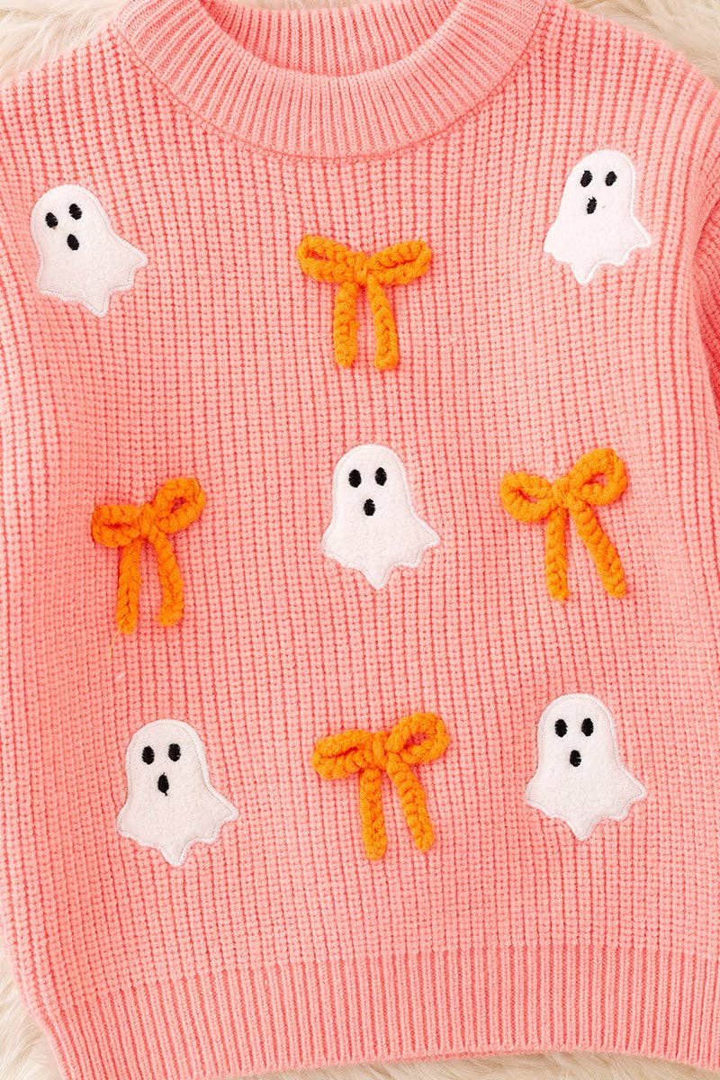 Ghost applique and orange embroidered bow on Coral knitted sweater.