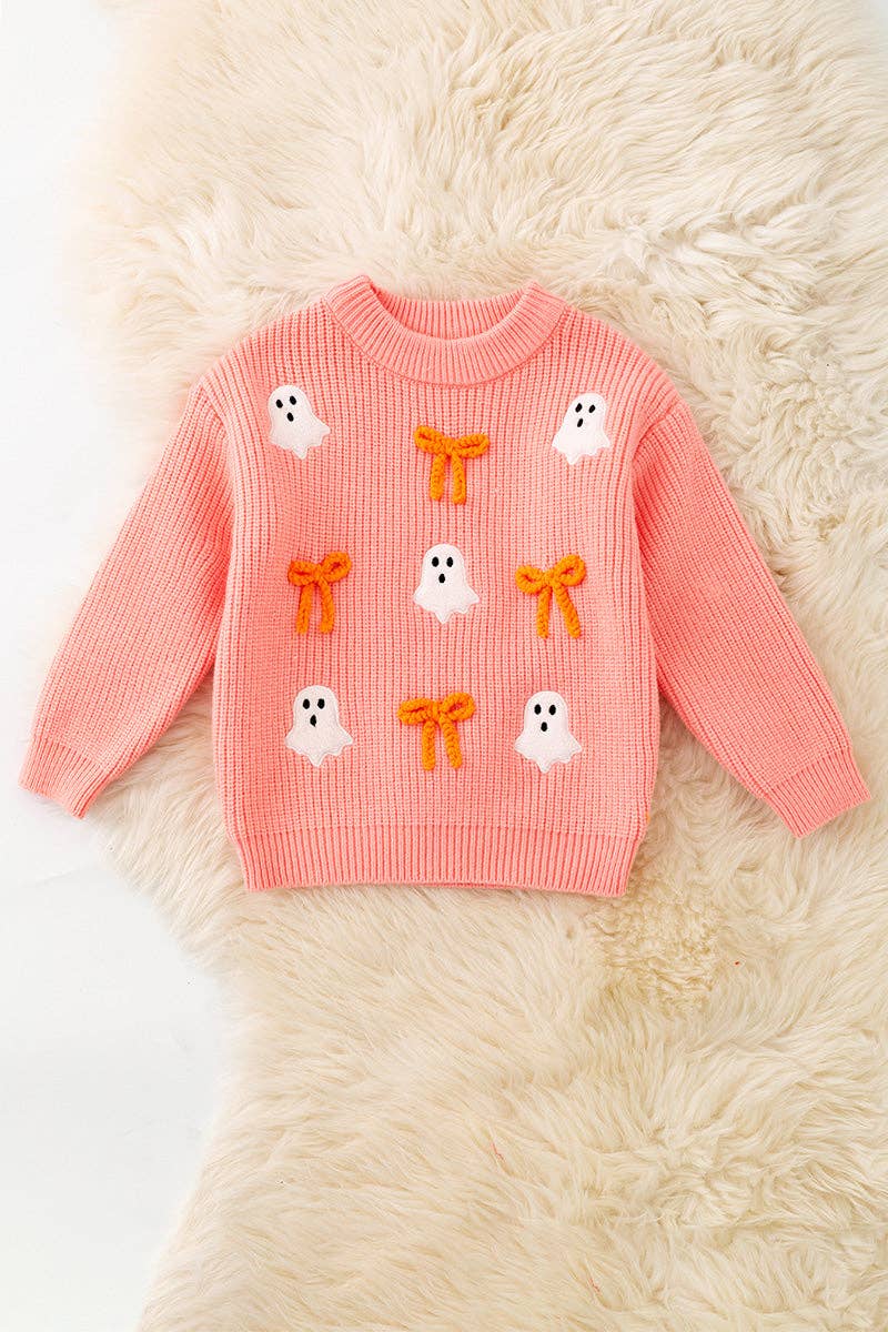 Ghost applique and orange embroidered bow on Coral knitted sweater.