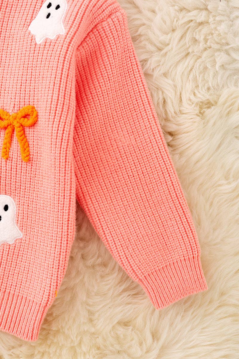 Ghost applique and orange embroidered bow on Coral knitted sweater.
